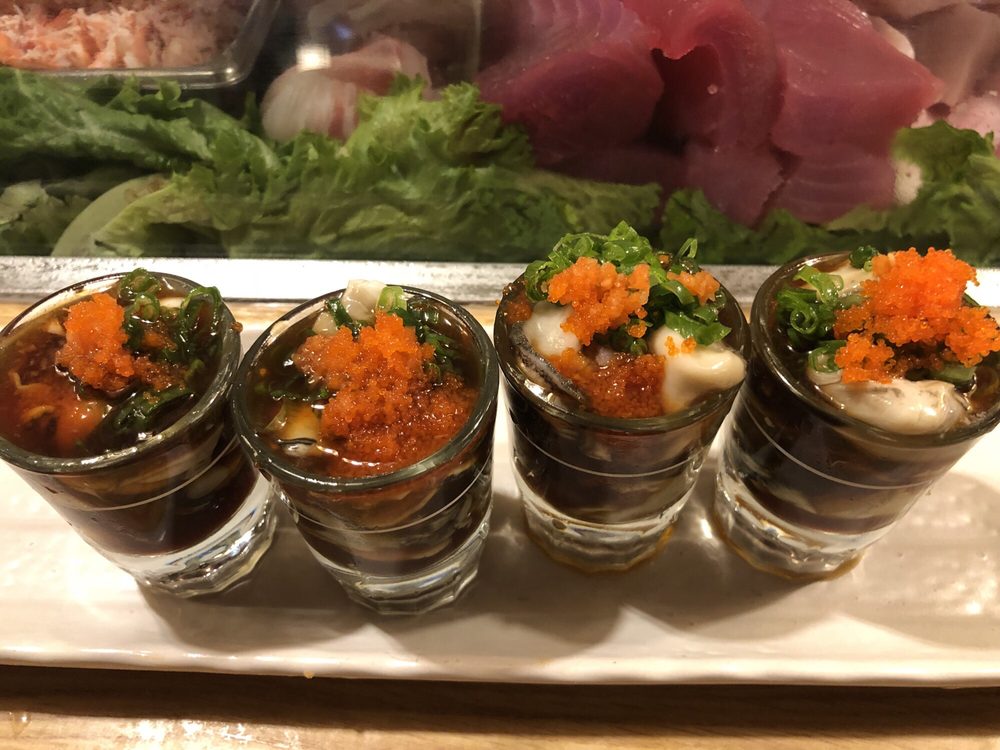 Shot glasses of chopped seafood topped with fish roe